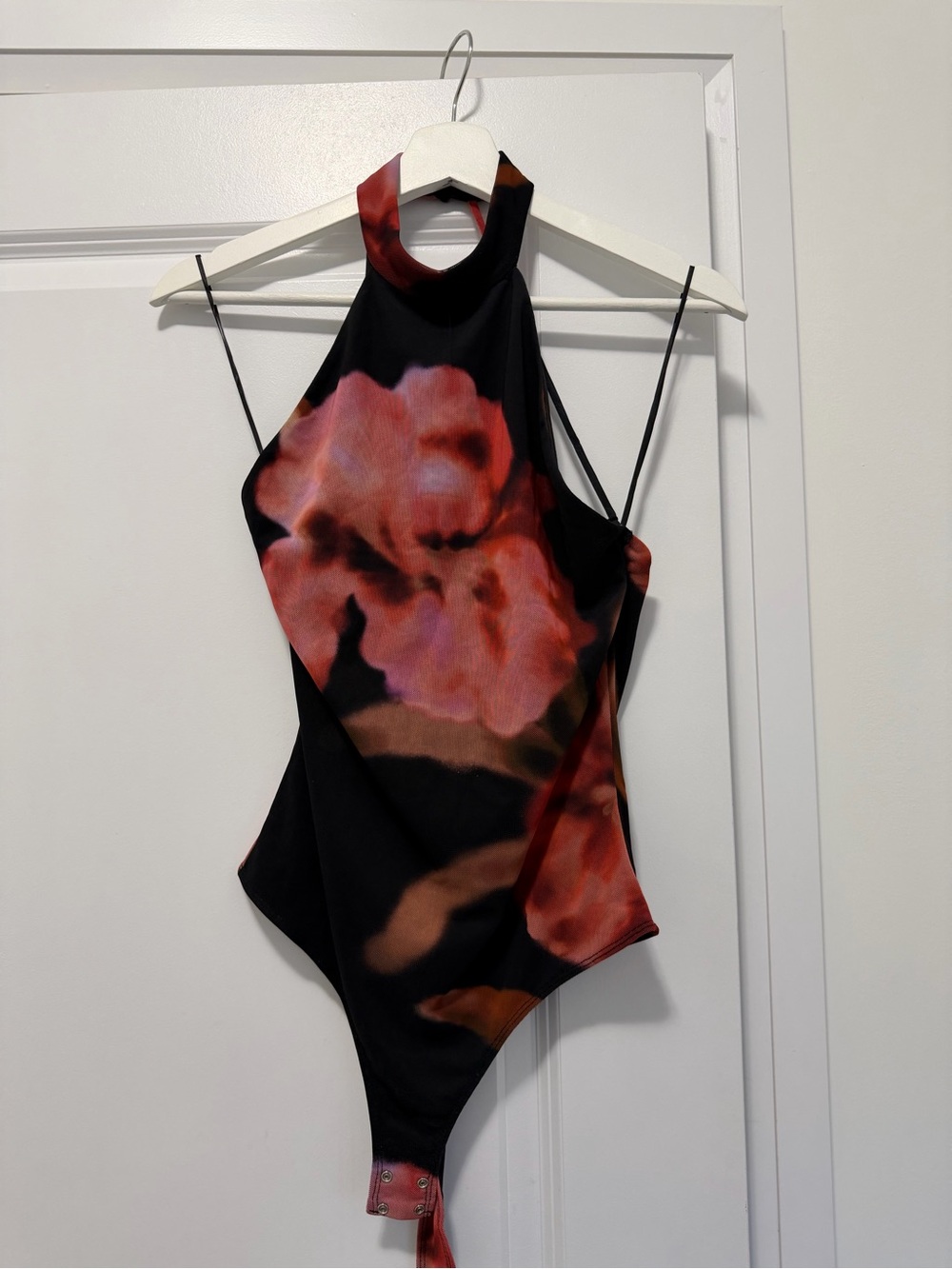 Dynamite Black One-Piece Bodysuit with Red Floral Print